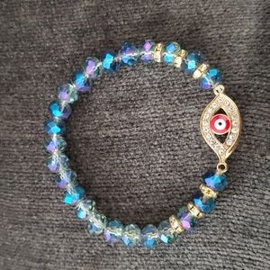HANDMADE IN TURKEY BLUE IRIDESCENT RED EVIL EYE BRACELET
